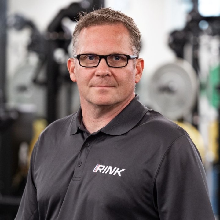 Headshot of Dr. Kolin Kriitmaa in the gym